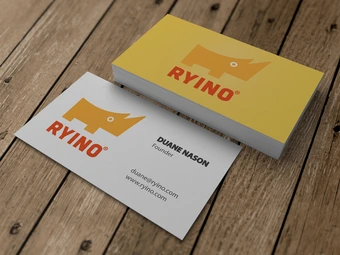 stack of business cards on wooden table