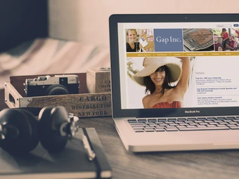 laptop computer on desk with web page open for GapInc.com