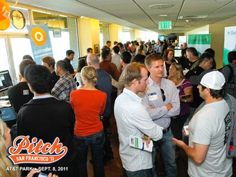 crowd of people talking at Expo event